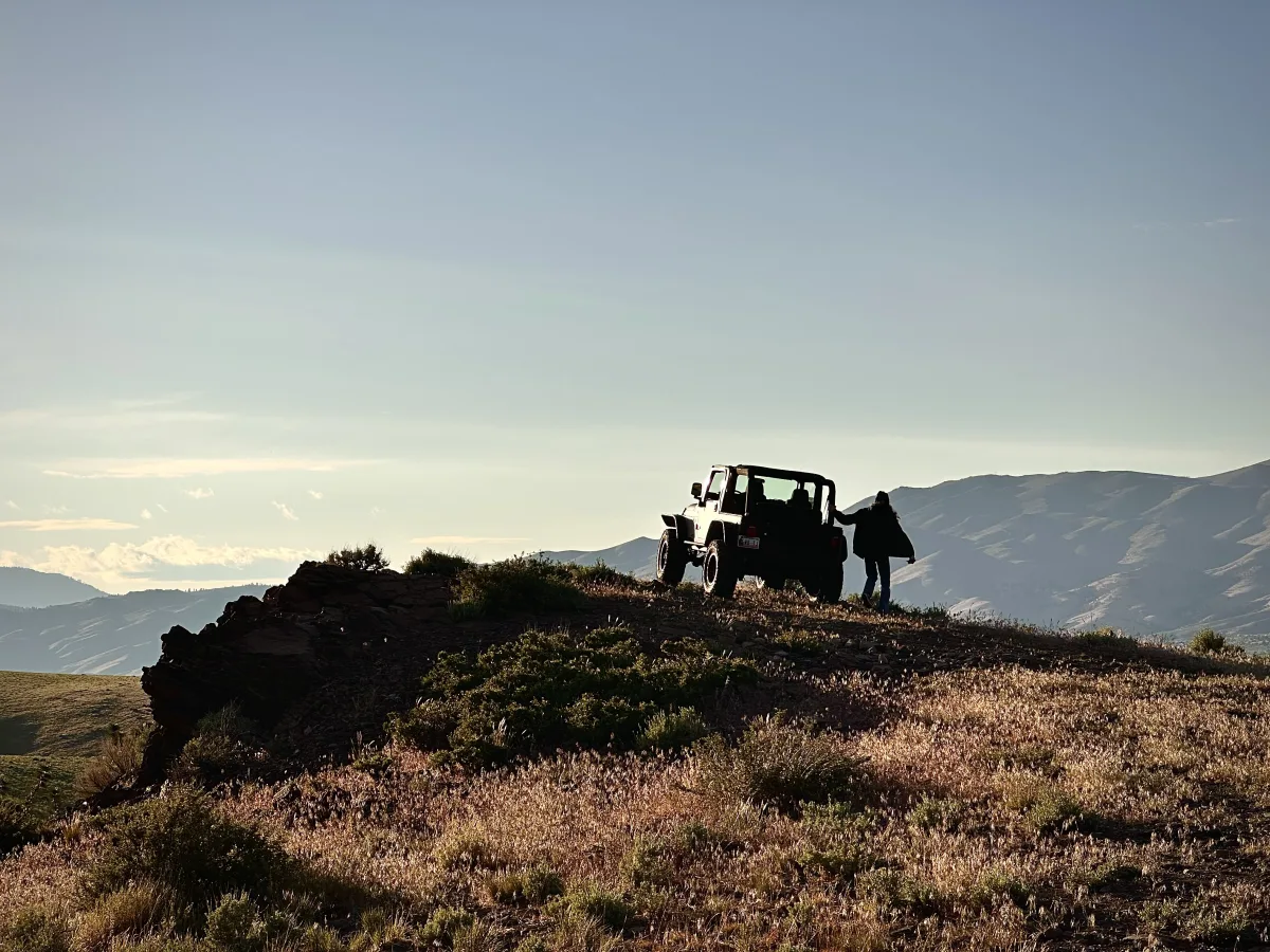 Wide landscape photo with a large open sky and distant mountain range.